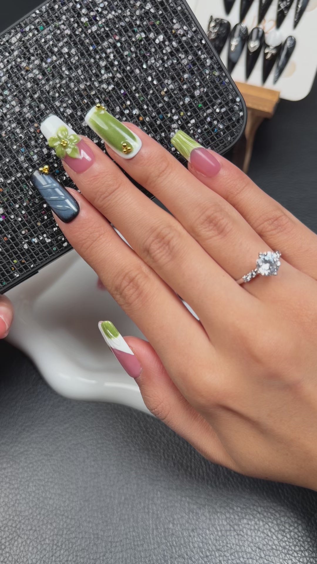 Load video: Step-by-step application of Olive Bloom pink, white and olive green floral short square press-on nails
