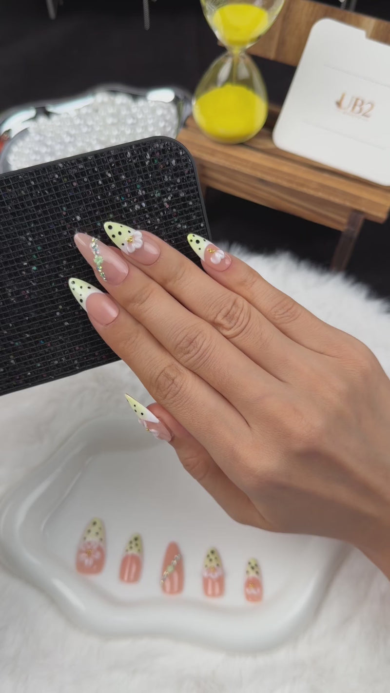 Step-by-step application of Lemon Blossom yellow polka dot French tip floral almond press-on nails